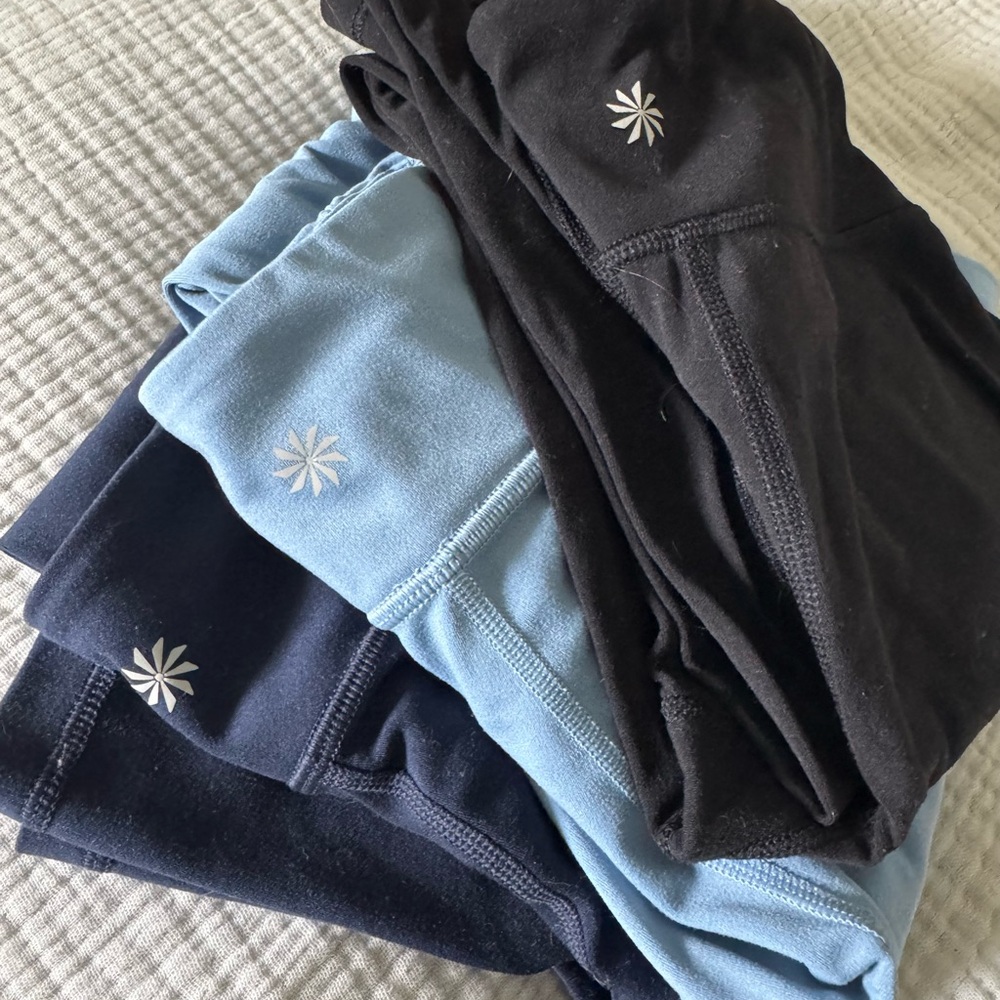 Athleta girls flares in navy, light blue, and black